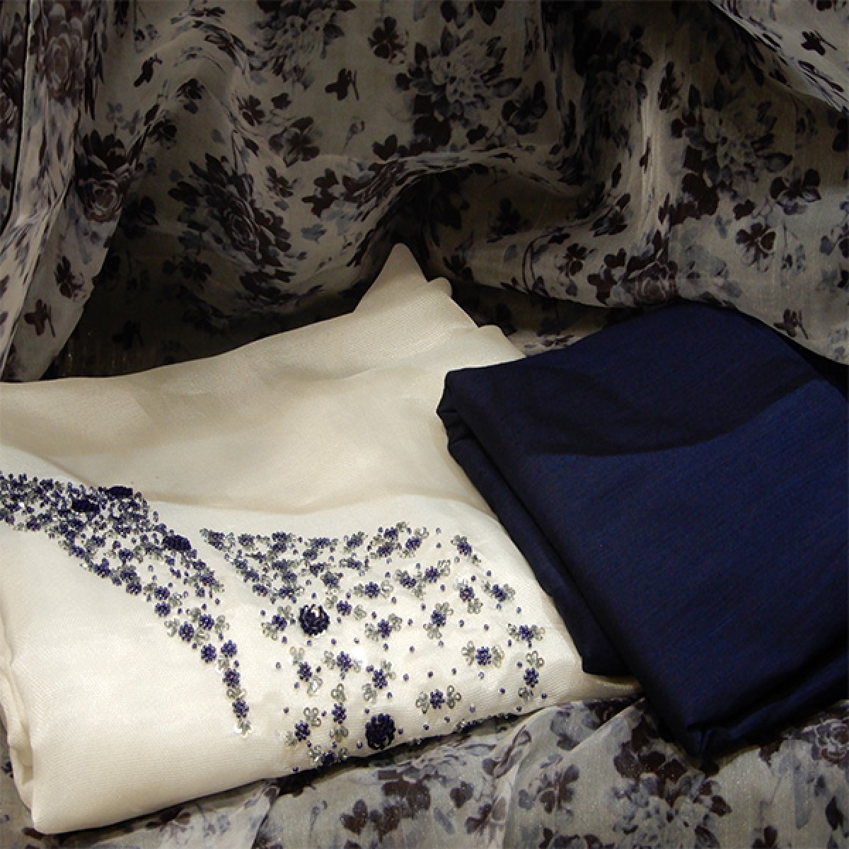 Shimmer georgette off white salwar materiel rich in navy blue bead and thread work on yoke portion