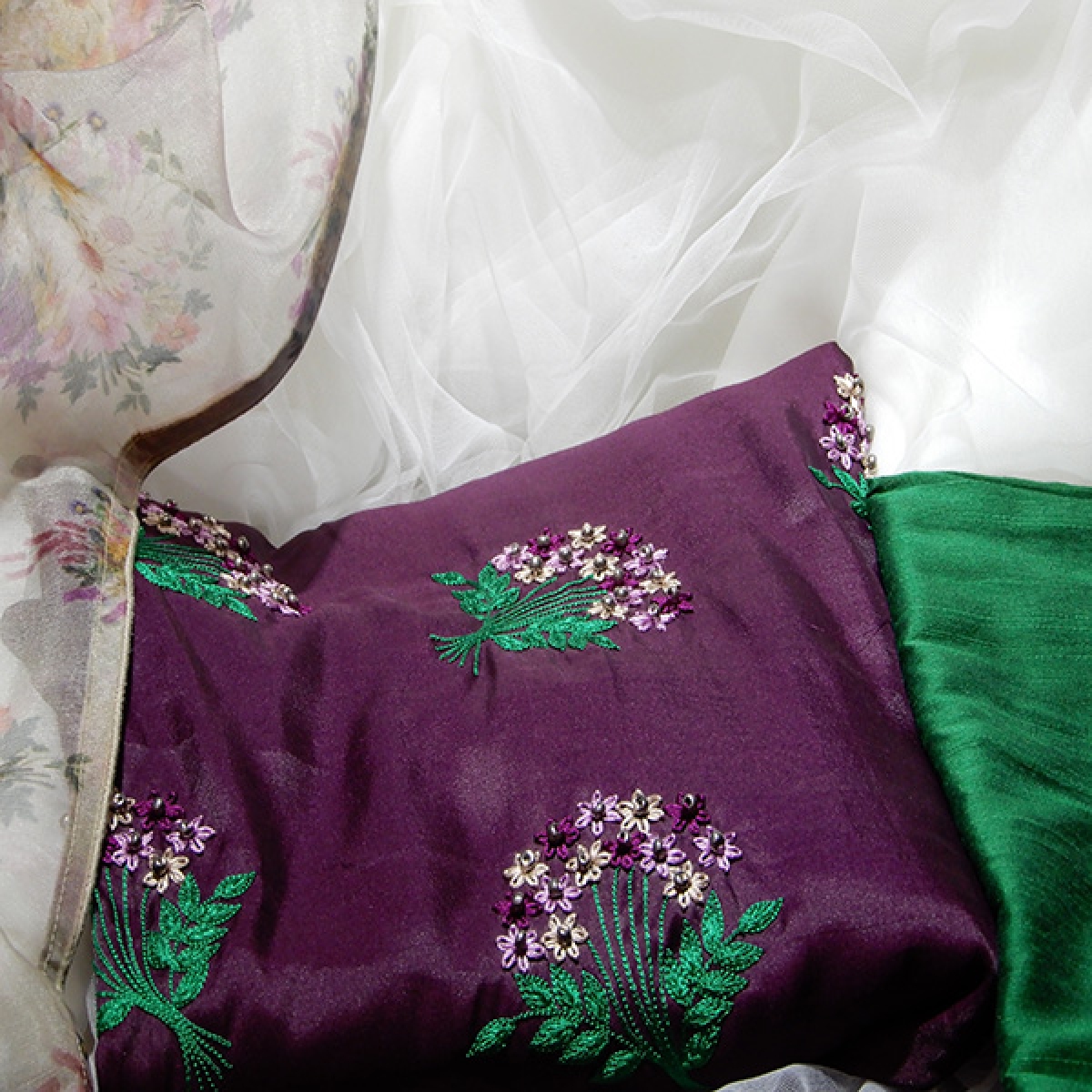 Dark purple tussar satin material with purple shades lazy daisy floral work on yoke part with matching printed organza