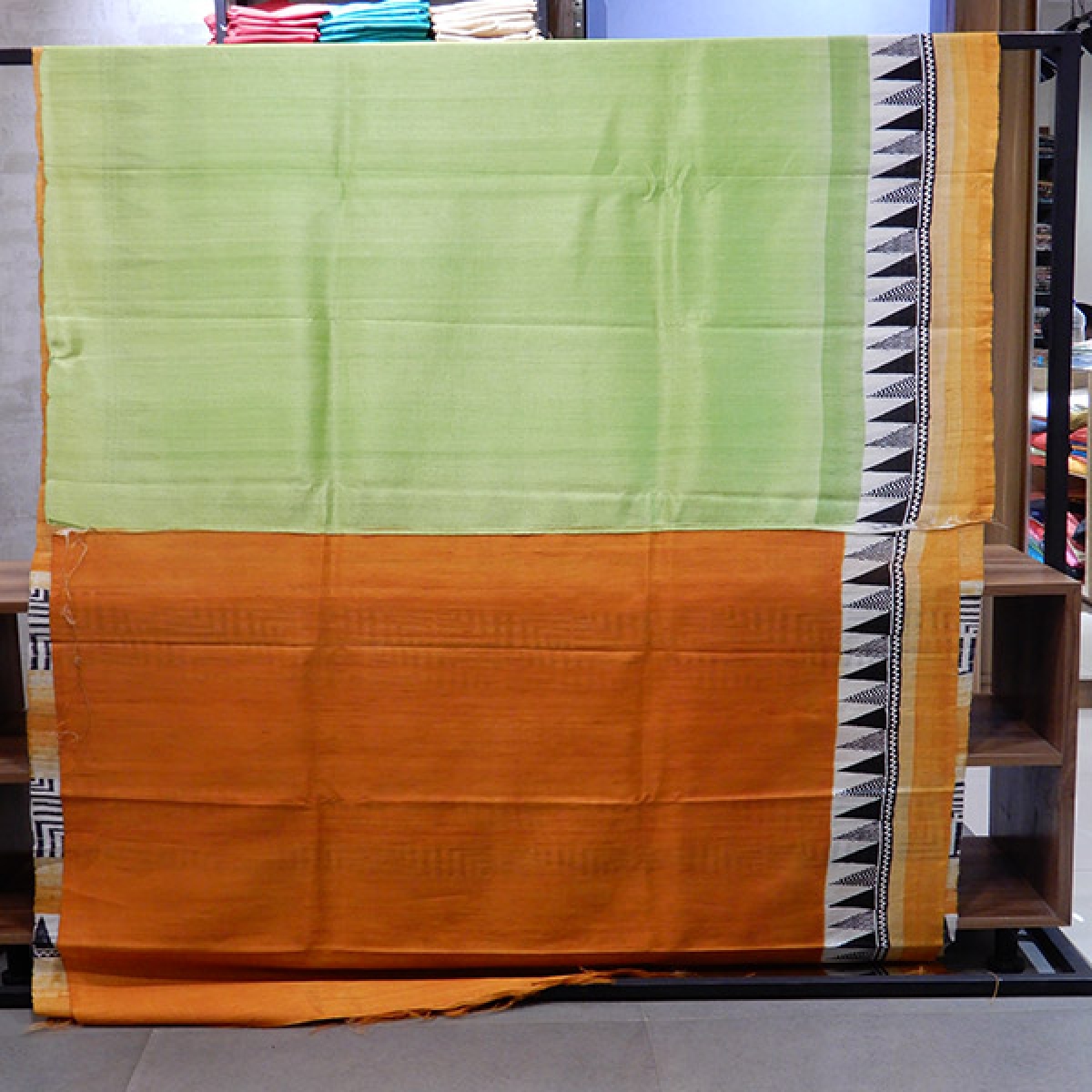 Pure Raw Silk saree with warm colours and printed border.Blouse piece attached.